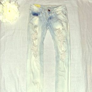 Distressed vintage light washed jeans by Machine